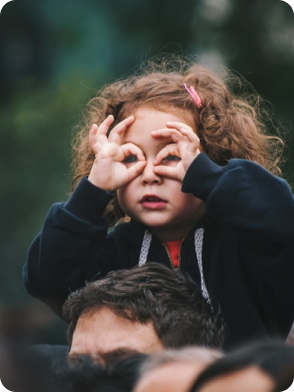 Two children playing, one in green shirt