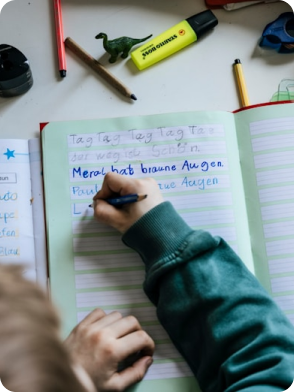 Two children playing, one in green shirt