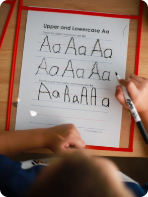 Two children playing, one in green shirt