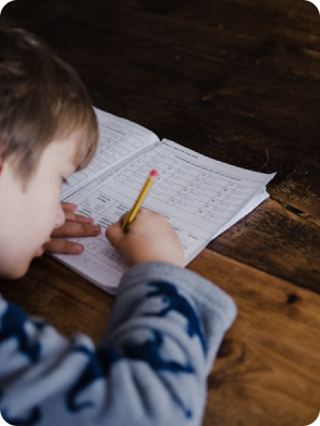 Two children playing, one in green shirt